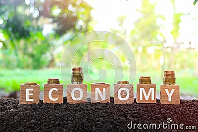 Economic recovery, economy bounce back, regain, rebound, pick up and business comeback concept. Wooden blocks with downward. Stock Photo