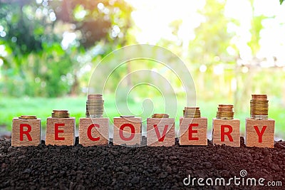 Economic recovery, economy bounce back, regain, rebound, pick up and business comeback concept. Wooden blocks with w shape. Stock Photo