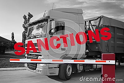 Economic sanctions. Truck on road in front of closed boom barrier. White and black toned design Stock Photo