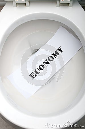 Economy in a white toilet Stock Photo