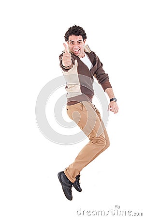 Ecstatic man showing thumbs up jumping of joy and excitement Stock Photo