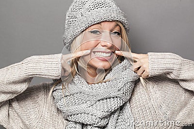 Ecstatic 20s winter girl expressing joy with fake smile Stock Photo