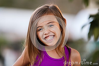 Ecstatic smiling brown haired four year old girl Stock Photo