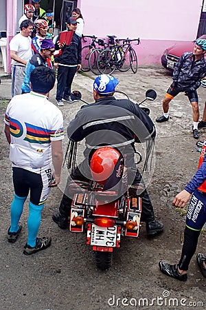 Ecuadorian bicyclists and motorcyclists Editorial Stock Photo