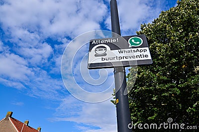 Edam, Netherlands, August 2019. A sign indicating a neighborhood watch is active in the area, using Whatsapp for communication Editorial Stock Photo