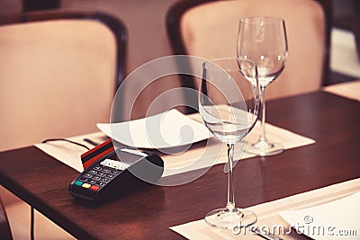 EDC machine or bankcard in reader on table in restaurant Stock Photo