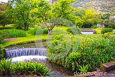 Eden garden fairytale waterfall fountain in the Giardino di Ninfa - Cisterna di Latina - Lazio - Italy Stock Photo