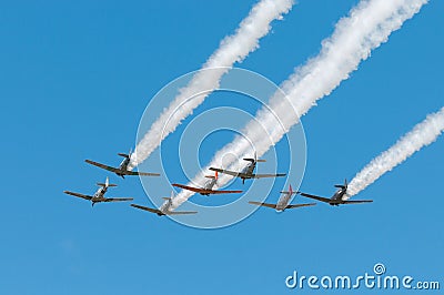 Seven AT-6 Texans Fly Away Trailing Smoke Editorial Stock Photo