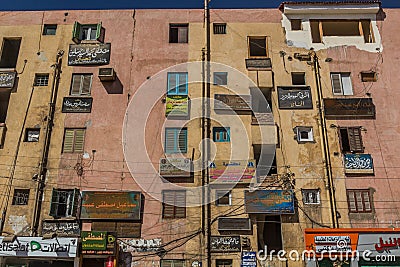 EDFU, EGYPT - FEB 17, 2019: House with signs in Edfu, Egy Editorial Stock Photo