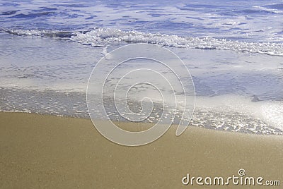 Edge of sea with golden sand Stock Photo