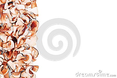 Edible dried mushrooms border on white background isolated close up, dry boletus edulis frame, brown cap boletus heap, penny bun Stock Photo