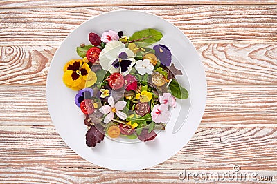 Edible flowers salad in a plate Stock Photo