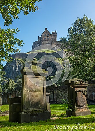 Edinburgh Castle And Ancient Cemetery Stock Photo