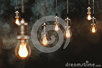 Edison light bulbs in front of a wooden wall Stock Photo