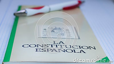 Book of the spanish constitution wiht a pen and the graphical white background Stock Photo