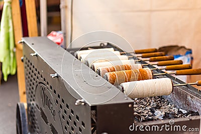 EDITORIAL, cooking Hungarian Chimney cakes Editorial Stock Photo