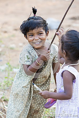 Editorial illustrative image. Poor kid smiling, India Editorial Stock Photo