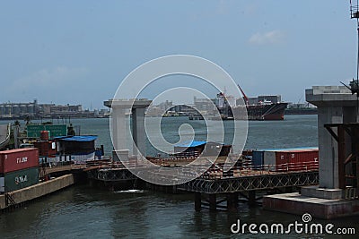 Editorial image of urban railway construction near mainland bridge Lagos. apapa port is seen in the background. Lagos Editorial Stock Photo