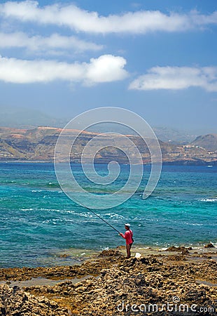 Editorial man fishing rocky coastline of Playa Las Cantera Las Editorial Stock Photo