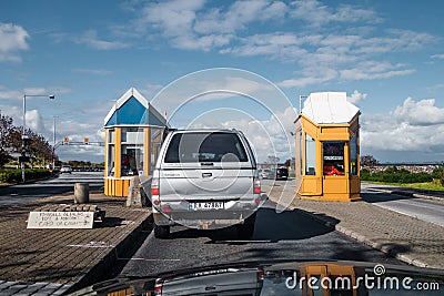 Toll booths before the car ferry from Mortavika to ArsvÃ¥gen, Norway Editorial Stock Photo