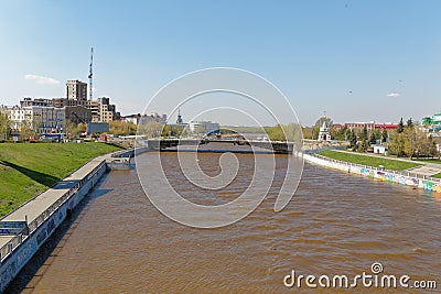 Omsk.Russia. A view of the Om River embankment and the renovated Jubilee Bridge Editorial Stock Photo