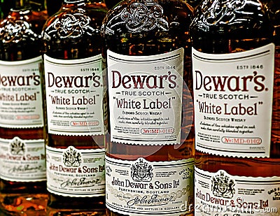 Editorial selective focus photo of Dewar`s White Label Scotch Whisky bottles - a brand of blended Scotch whisky Editorial Stock Photo