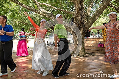 Senior Chinese enjoy dancing in the park. Editorial Stock Photo