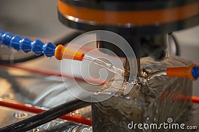 The EDM,Electric Discharge Machine with the copper electrode. Stock Photo
