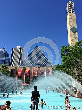 A group of young children and parents enjoying an outdoor wading pool Editorial Stock Photo