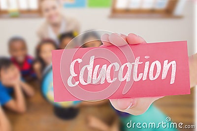 Education against cute pupils and teacher in classroom with globe Stock Photo