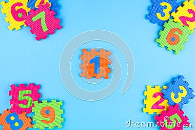 Colorful kids numbers toys on blue background Stock Photo