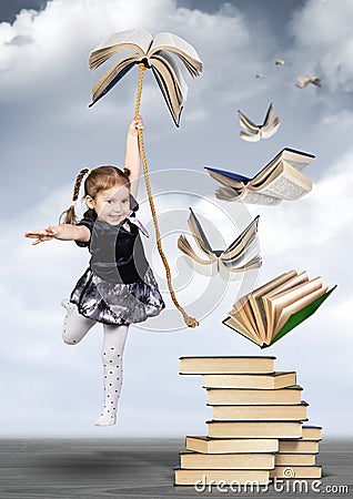 Education creative concept , child girl fly on book Stock Photo