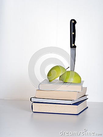 Education cuts - putting the knife in metaphor Stock Photo