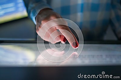 Woman using interactive touchscreen display at modern museum or exhibition Stock Photo