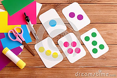 Education flash cards for kids. Learning colours. Teaching kids to count. Scissors, pencil, glue, colored cardboard sheets Stock Photo
