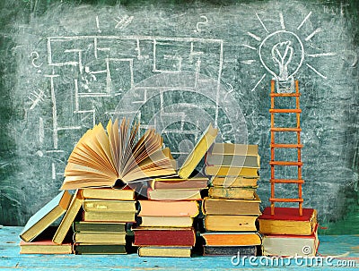 Education gives orientation,books,blackboard and ladder of success.Learning,knowledge,humanism, back to school concept Stock Photo