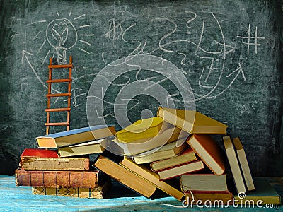 Education gives orientation,books,blackboard and ladder of success.Learning,knowledge,humanism, back to school concept Stock Photo