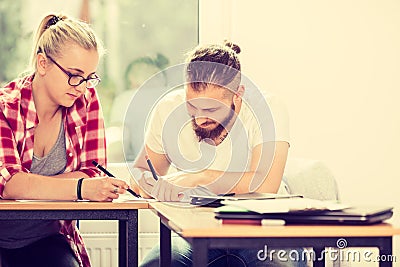 Two students talking in classroom Stock Photo