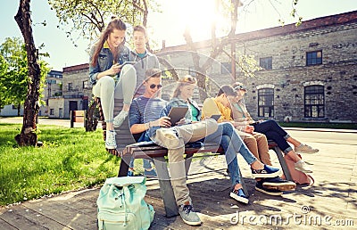 Group of students with tablet pc at school yard Stock Photo