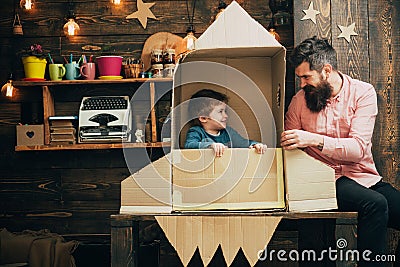 Education and kid idea development. education concept with family of father and little kid in paper rocket. Stock Photo