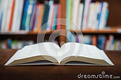 Education learning concept with opening book or textbook in old library, stack piles of literature text academic archive on readin Stock Photo