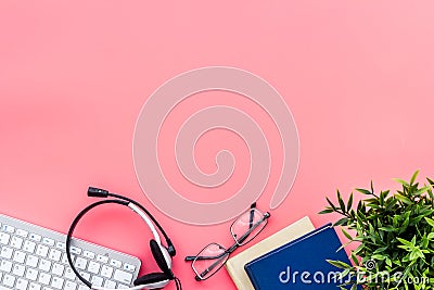 Education online school concept. Books, computer and headphones on pink table top view frame space for text Stock Photo