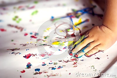 Education, school, art and painitng concept - little girl showing painted hands Stock Photo