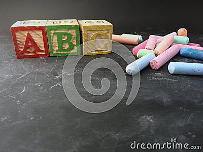 education shown with chalk and preschool blocks Stock Photo