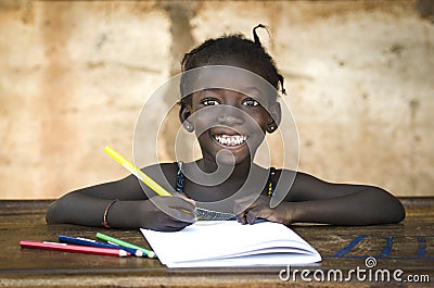 Education Symbol: Big Toothy Smile on African School Girl. Gorge Stock Photo