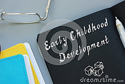 Educational concept meaning Early Childhood Development with sign on the sheet Stock Photo