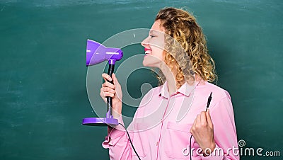 Educational idea. Light up process of studying. Knowledge day. Teacher hold table lamp in hand chalkboard background Stock Photo