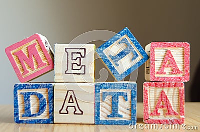 Educational toy cubes with letters organised to display word metadata - keywording and Search engine optimisation Stock Photo