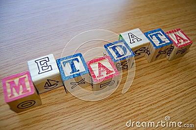 Educational toy cubes with letters organised to display word metadata - keywording and Search engine optimisation Stock Photo