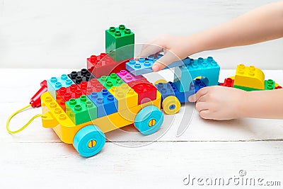 Educational toys. The child plays with the Lego designer Stock Photo